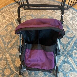 Children’s toy double stroller for larger dolls.